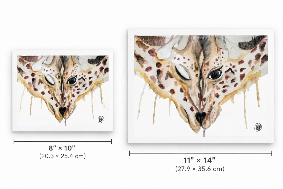 Two framed giraffe art prints shown side by side with size labels: an 8 x 10 inch version and an 11 x 14 inch version. The artwork features a watercolor-style giraffe face with tan, brown, cream, and black tones on a white background.
