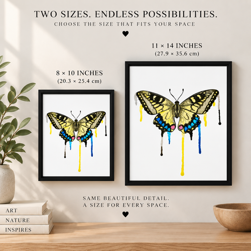 Two black framed canvases showing a yellow butterfly with paint drips in 8 x 10 and 11 x 14 inch sizes on a wall.